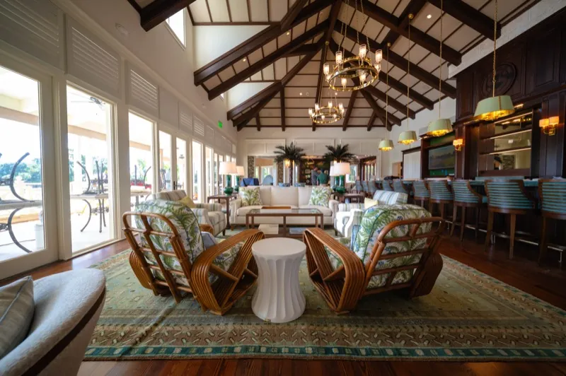 Card Sound Clubhouse lounge and bar under a vaulted wood-beam ceiling