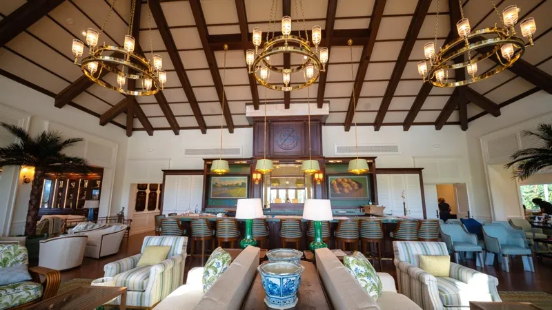 Card Sound Clubhouse lounge with chandeliers and built-in bar