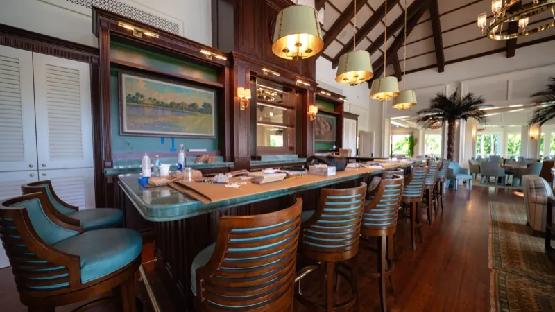 Card Sound Clubhouse bar counter with artwork and barstools