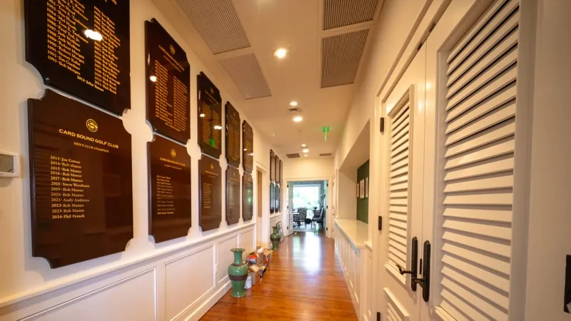 Card Sound Clubhouse hallway with commemorative plaques
