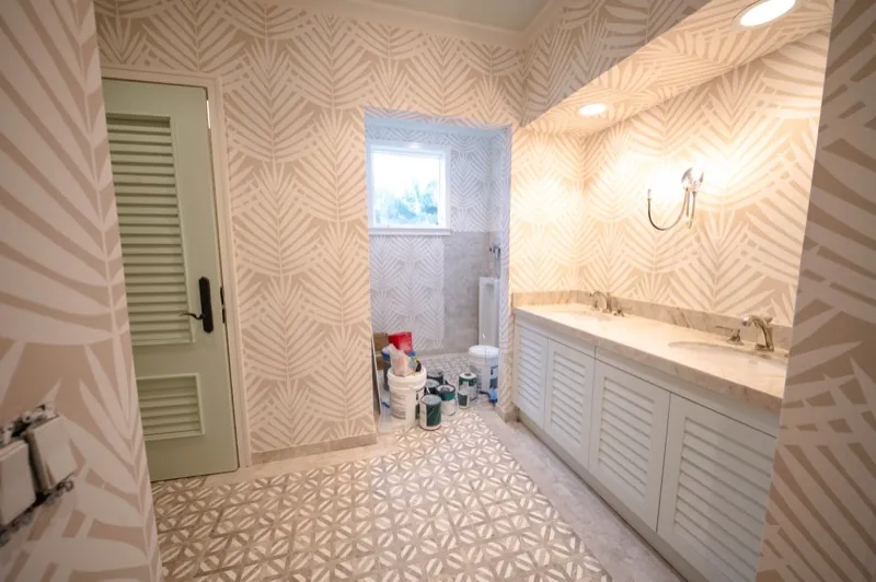 Card Sound Clubhouse bathroom with palm-leaf pattern wallcovering, installed by Wallcovering Pro