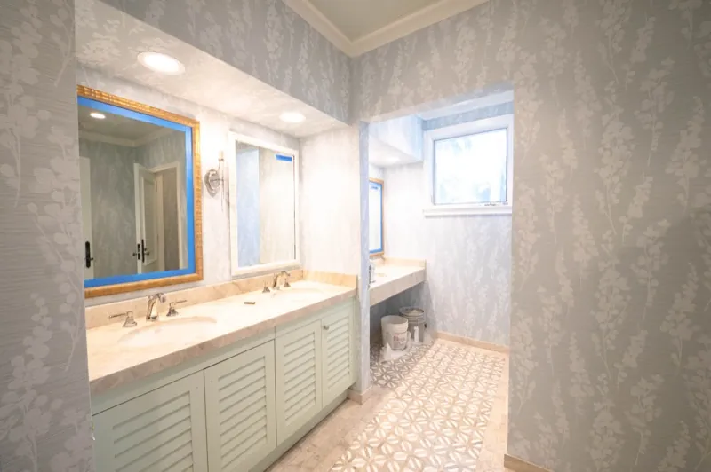 Card Sound Clubhouse bathroom with blue-grey textured wallcovering, installed by Wallcovering Pro
