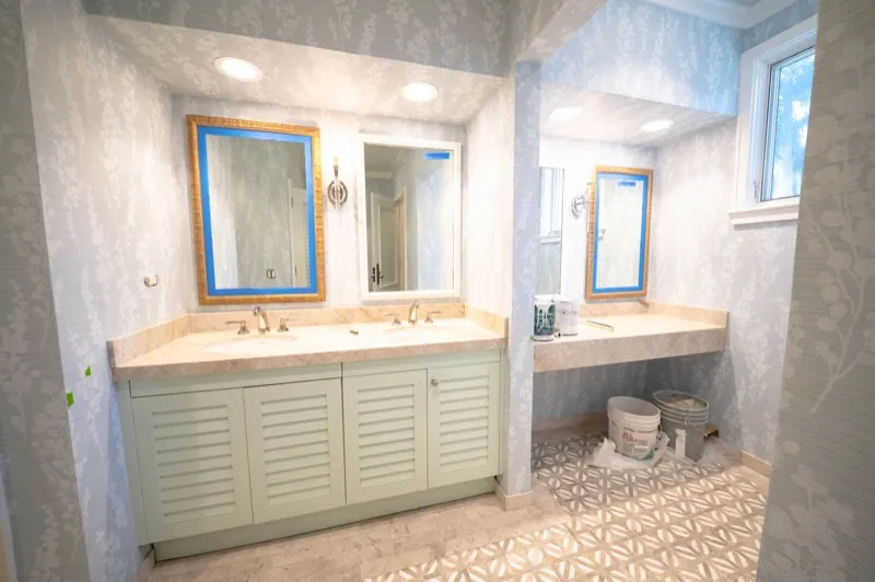 Card Sound Clubhouse double vanity with blue-grey textured wallcovering, installed by Wallcovering Pro