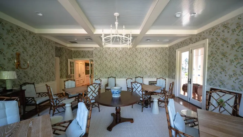 Card Sound Clubhouse porch sitting area with floral wallpaper, installed by Wallcovering Pro