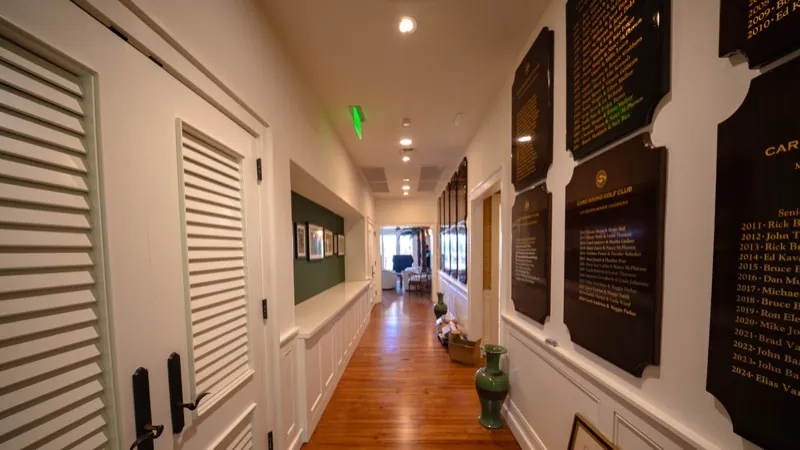 Card Sound Clubhouse hallway with commemorative plaques