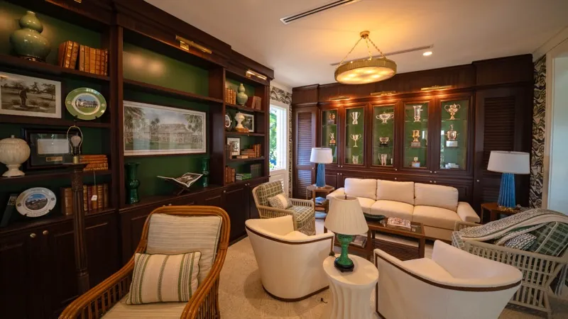 Card Sound Clubhouse library lounge with glass display cabinets