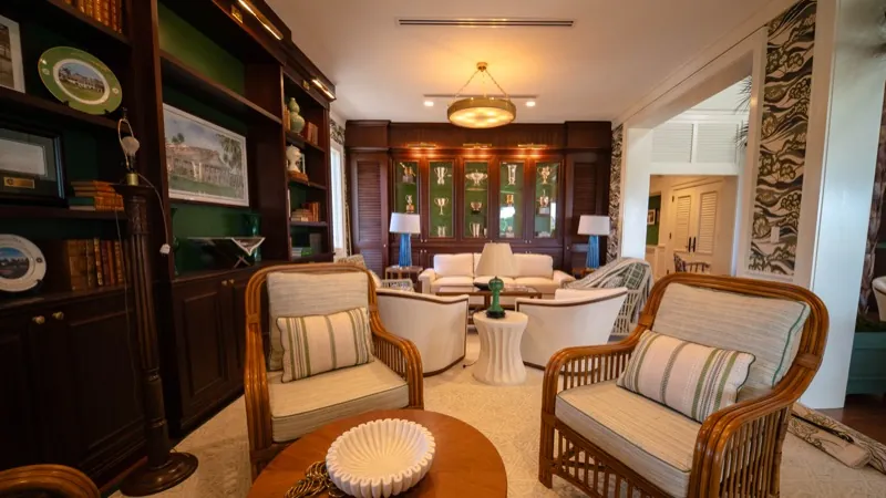 Card Sound Clubhouse library lounge corner with bookcase and armchairs
